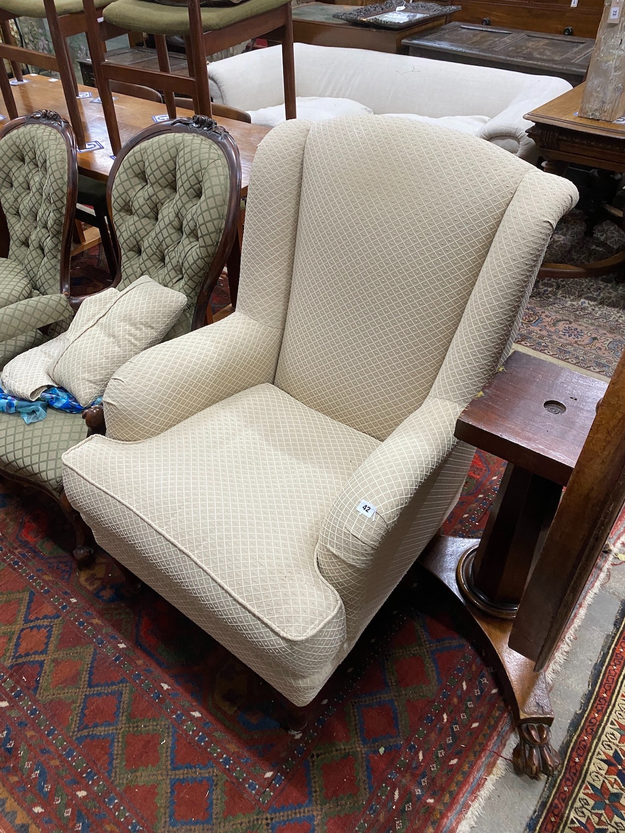 A modern Wesley-Barrell upholstered armchair